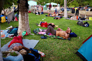 Migrants taking part in a caravan toward the northern border rest at a park, in Los Corazones, Oaxaca state, Mexico, January 8, 2024. 