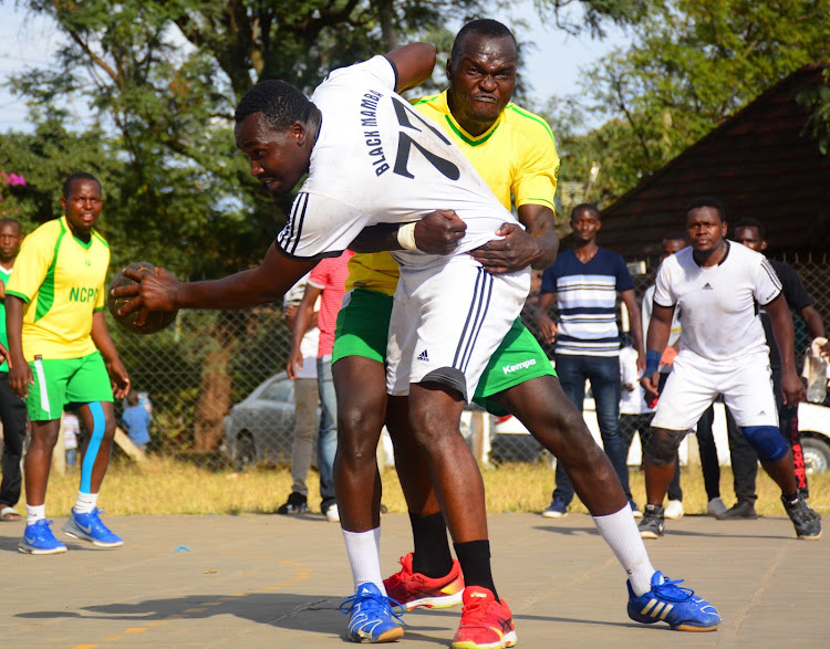 NCPB's Elvin Otieno tackles Martin Ngugi of Black Mamba in a past handball league match.