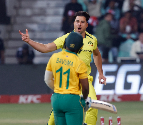 Australia's Marcus Stoinis celebrates after taking the wicket of South Africa's Temba Bavuma.
