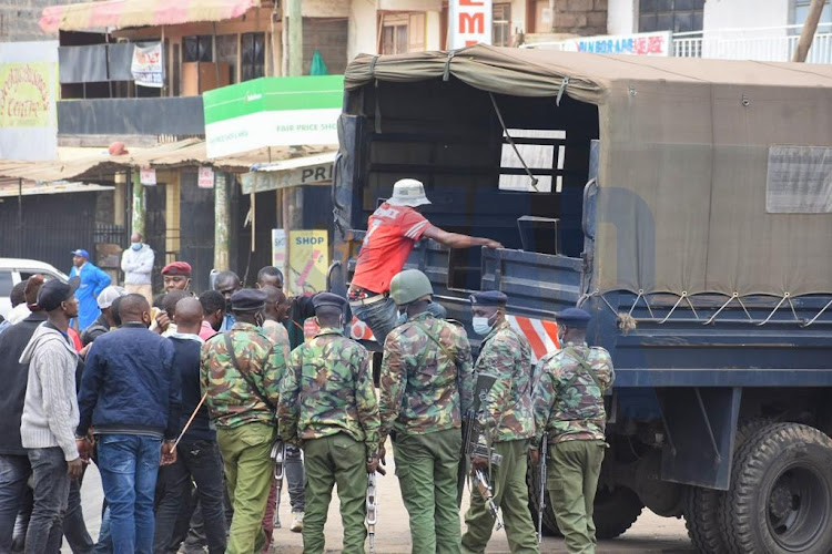 Police arresting some of protesters as they restore calm in Kahawa, Kiambu County.