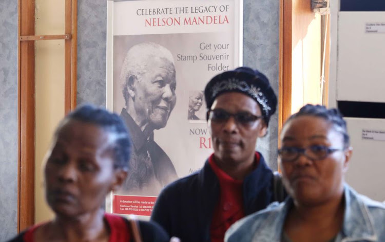 Women hold a prayer meeting inside the Post Office where Uyinene Mrwetyana was killed.