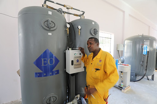 Daahir Mohamed Nor, a Somali worker, installs the public oxygen plant amid the coronavirus disease (COVID-19) pandemic at the Banadir Hospital in Mogadishu, Somalia September 28, 2021. Picture taken September 28, 2021.