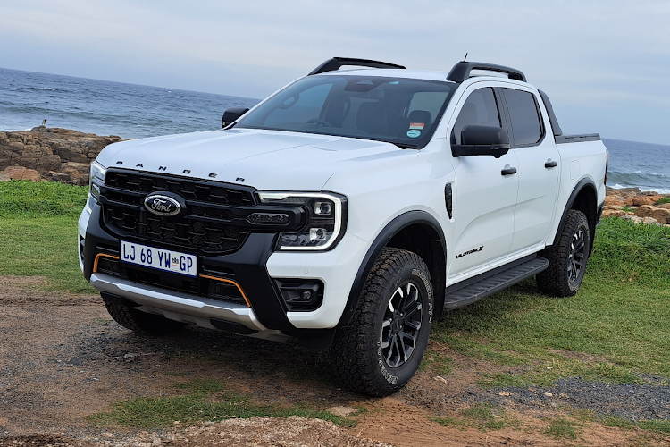 The Wildtrak X has a wider stance, raised ride height and black and orange accents.