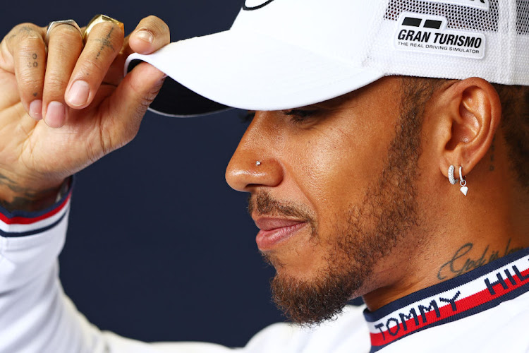 Lewis Hamilton talks to the media in the Paddock during previews for the F1 Grand Prix of Japan at Suzuka International Racing Course on October 6 2022.