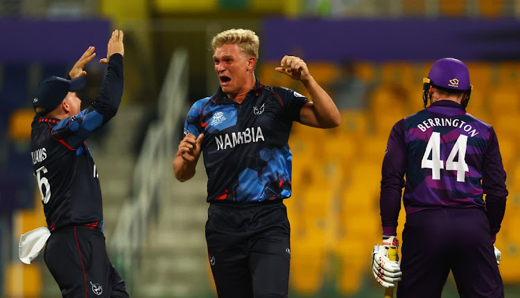 Namibia's Ruben Trumpelmann celebrates the wicket of Richard Berrington of Scotland during the T20 World Cup match at Sheikh Zayed stadium on October 27, 2021 in Abu Dhabi