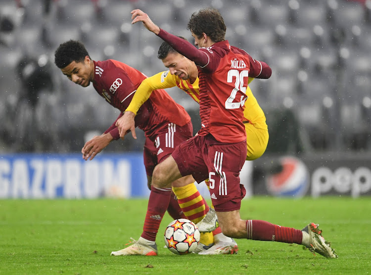 Bayern Munich's Thomas Muller in action with Barcelona's Clement Lenglet