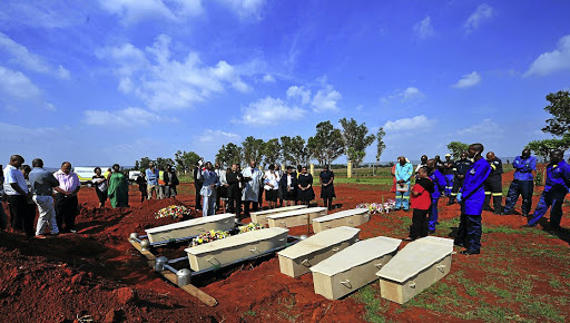 The 42 corpses that brought a busy Johannesburg highway to a standstill last week after a trailer spilt them onto the road were finally buried at Olifantsvlei Cemetery, Johannesburg, yesterday./ Veli Nhlapo