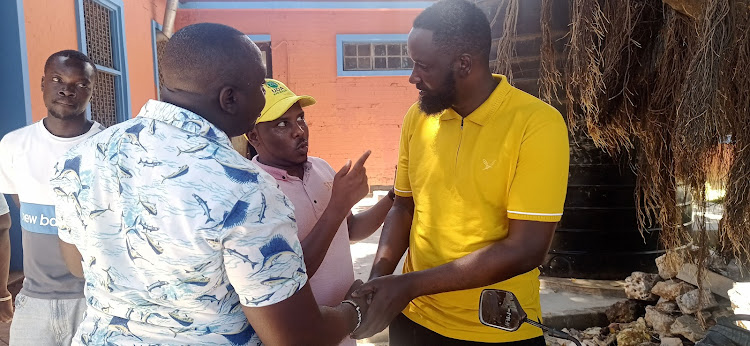 UDA's John Walele, Ibrahim 'Magufuli" Dube and Coast regional manager Khalif Abdi at the Tononoka Social Hall on Tuesday.