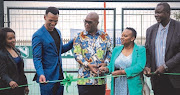 Minister of Sports, Arts and Culture, Nathi Mthethwa (M) at the new multipurpose sports court at Soshanguve South Secondary School on the outskirts of Pretoria.