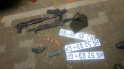 Different number plates, gloves and balaclavas, as well as guns and ammunition were also found by the police.