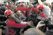 ORDER DEFIED: Public order police were  called 
      
       while police in 
      
       riot gear manned the entrance to 
      
       the House after EFF members refused to leave the chamber 
      
    
      Photo: Trevor Samson