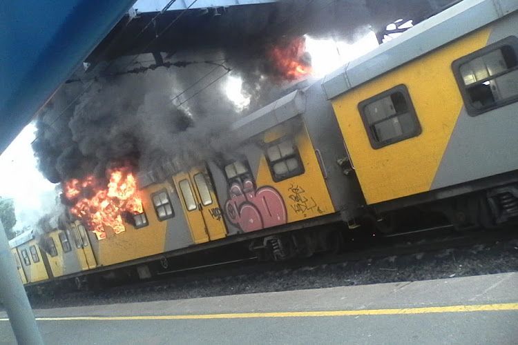 Flames leap from a train at Retreat station, Cape Town, on July 26, 2018.