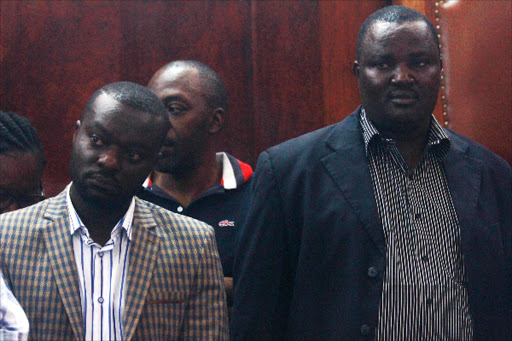 Kisumu minority leader Edwin Anayo with suspended majority leader Samuel Ong’ow in court over corruption charges at Kisumu Law courts on Tuesday.Photo Maurice Alal