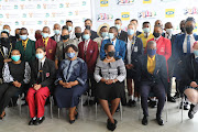 Minister of basic education Angie Motshekga along with the 33 top achievers from the class of 2021 during a breakfast meeting in Houghton, Johannesburg.