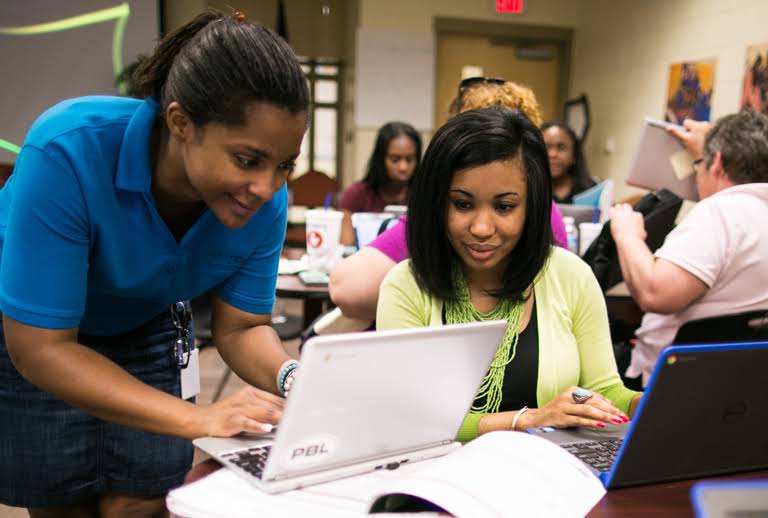 Two women working together.