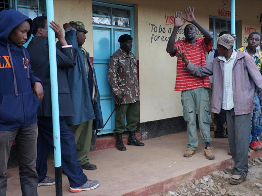 Youths at Gitithia Primary School polling station on Thursday during the botched Jubilee Party nominations. Their names were not on the register but they insisted they had listed to vote / GEORGE MUGO