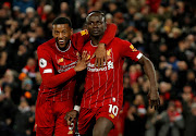 Sadio Mane celebrates scoring a goal with Georginio Wijnaldum.