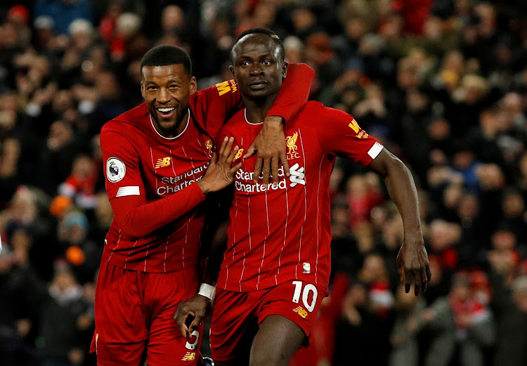 Sadio Mane celebrates scoring a goal with Georginio Wijnaldum.