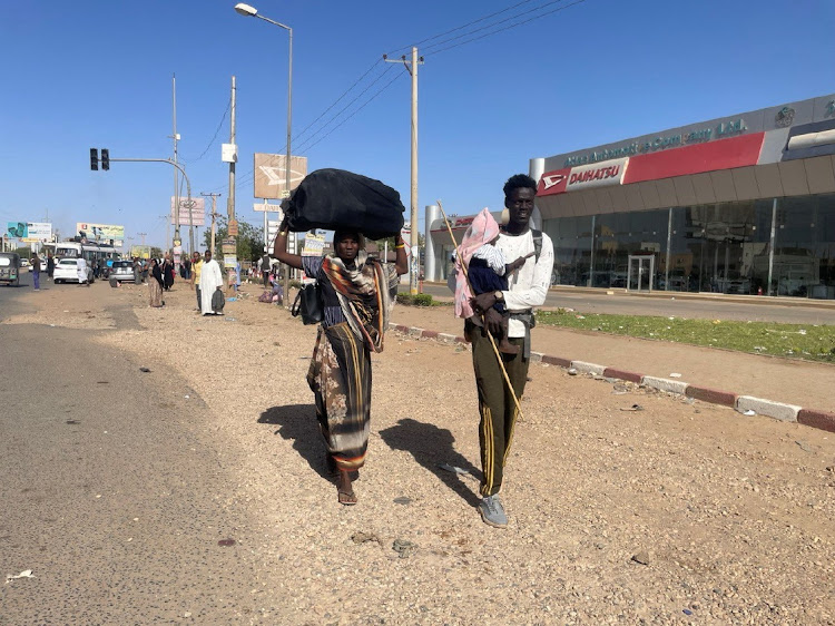 People gather at the station to flee from Khartoum during clashes between the paramilitary Rapid Support Forces and the army in Khartoum, Sudan April 19, 2023. REUTERS/