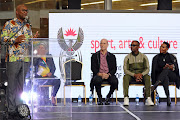 Minister Nathi Mthethwa welcomes  Wouter Kellerman, Zakes Bantwini and Nomcebo Zikode at the OR Tambo International Airport.