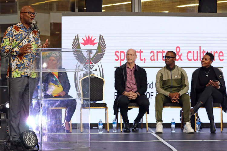 Minister Nathi Mthethwa welcomes Wouter Kellerman, Zakes Bantwini and Nomcebo Zikode at the OR Tambo International Airport.