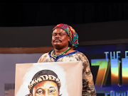 Lebani “Rasta” Sirenje shows his portrait of  Zulu King Misuzulu kaZwelithini.