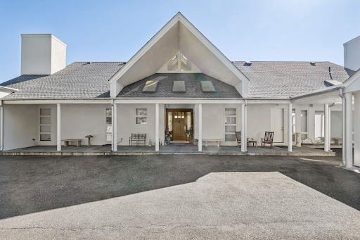 Modern white house with covered porch - Buy this luxury property in Laurel Hollow, 3 bedrooms