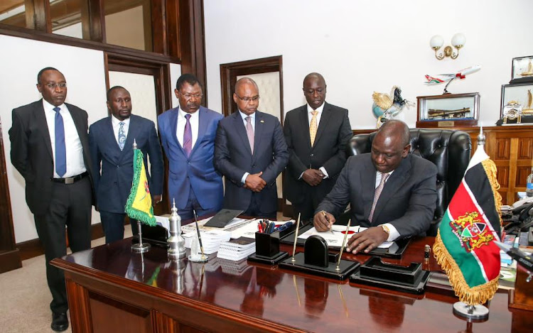 President William Ruto assenting to the County Governments Additional Allocation Bill, 2022 at State House on December 12, 2022