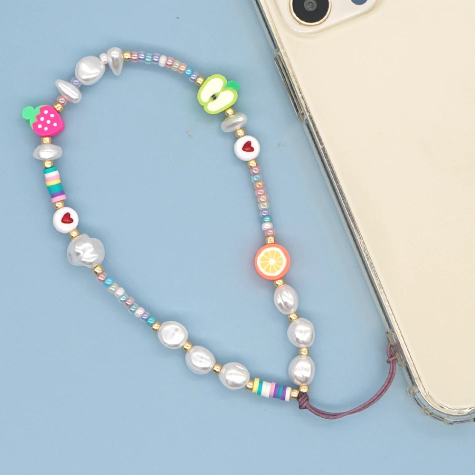 Lanière de téléphone portable en perles de riz de verre imprimées européennes et américaines, élégante et pratique pour transporter votre mobile.