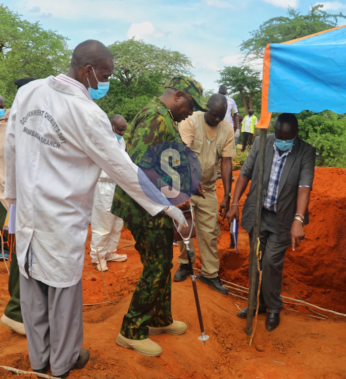 IG of Police Japhet Koome with officers during exhumation of bodies in Shakahola cult site in Kilifi County on April 24,2023.