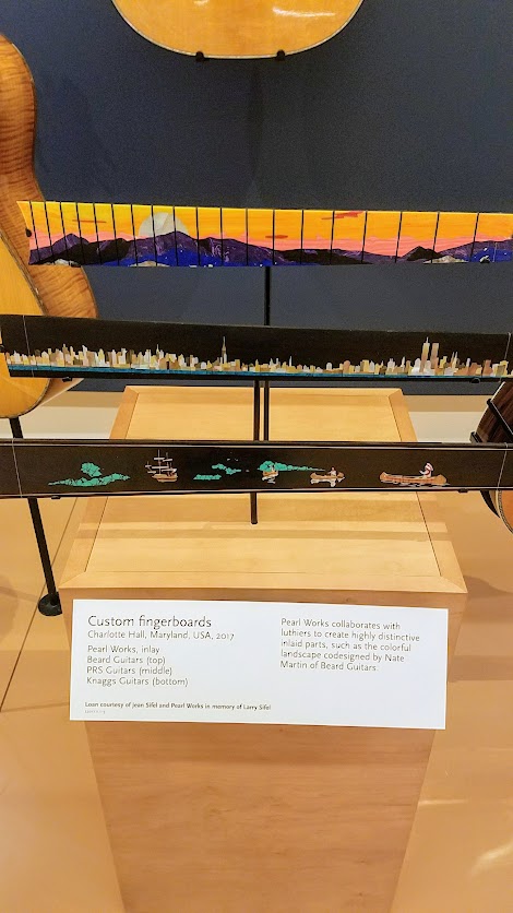 Music Instrument Museum (MIM) Geographic galleries, Custom Fingerboards. Pearl Works collaborates with luthiers to create highly distinctive inlaid parts. Pearl Works, inlay; Beard Guitars (top), PRS Guitars (middle), Knaggs Guitars (bottom)