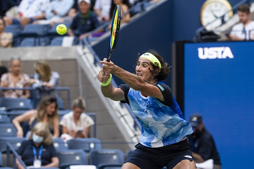 Lloyd Harris of South Africa hits a backhand against Alexander Zverev of Germany in the quarterfinals of the men's singles at the US Open at the USTA Billie Jean King National Tennis Center in New York on September 8 2021.