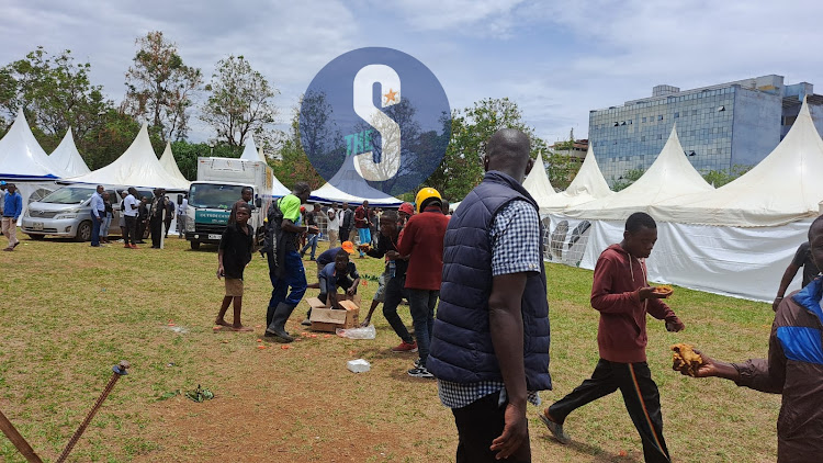 Some of the protestors eating the food from catering ten at the CAK event in Kisumu on March 15, 2023