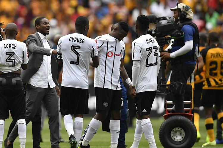 Orlando Pirates coach Rhulani Mokwena comfort his players Tshegofatso Mabasa during the Absa Premiership match between Kaizer Chiefs and Orlando Pirates at FNB Stadium on November 09, 2019 in Johannesburg, South Africa.