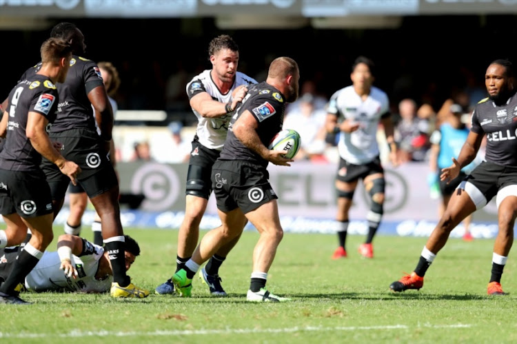 Cell C Sharks Wian Vosloo stops the ball kicked by Keisuke Uchida with Grant Hattingh looking on during the Super Rugby match between Cell C Sharks and Sunwolves at Kings Park Stadium on March 10, 2018 in Durban, South Africa.