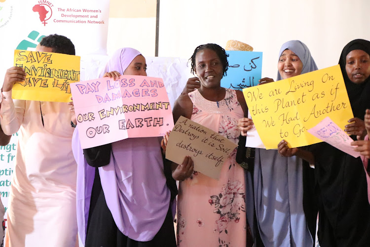 Environmental Activists from Garissa displaying banners.