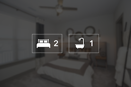 Icons showing two bedrooms and one bathroom for an apartment 