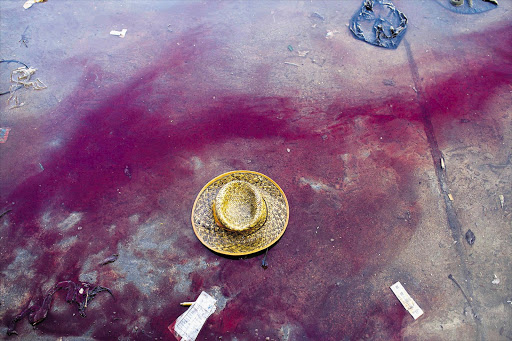 Blood flows where a National Transitional Council fighter was injured by a pro-Gaddafi sniper in a street battle in the centre of the Libyan city of Sirte on Wednesday. The council fighters say this is the final assault on Muammar Gaddafi's home town Picture: MAJID SAEEDI/GALLO IMAGES
