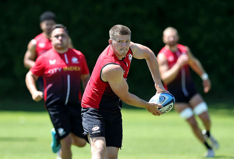 Owen Farrell passes the ball during a Saracens training session ahead of the Gallagher Premiership Rugby final on June 14, 2022 in St Albans