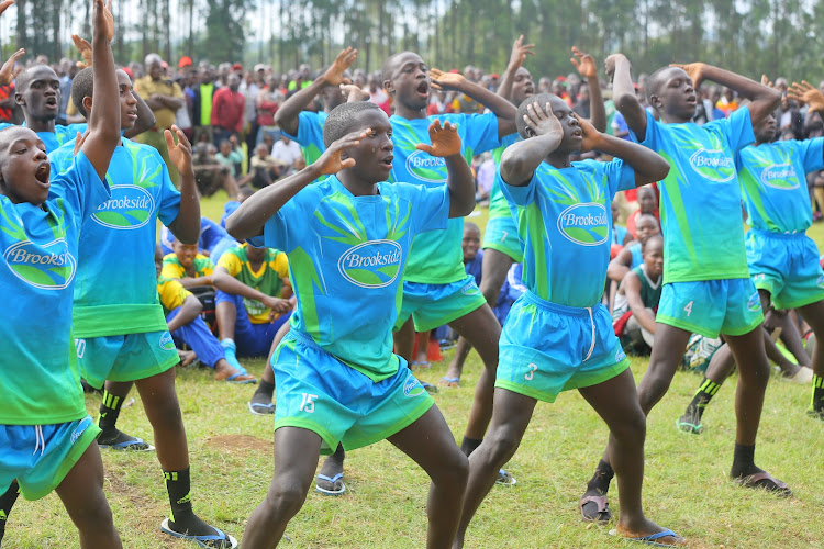 Kisi School rugby 7's team perform a mock haka after lifting the county title