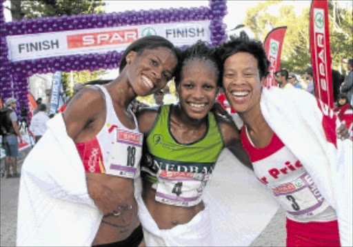 HAPPY: The top 3 finishers in the SPAR Women's Challenge run in Cape Town yesterday. From left to right: Mapaseka Makhanya (2nd), the winner Rutendo Nyahora and Zintle Xiniwe (3rd).Photo: Reg Caldecott