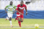 HEADING EAST: Free State Stars vice-captain Paulos Masehe, right, is ch
      a
      llenged by a  Bloemfontein Celtic player during their Absa Premiership derby last season 
      Photo: Gallo Images