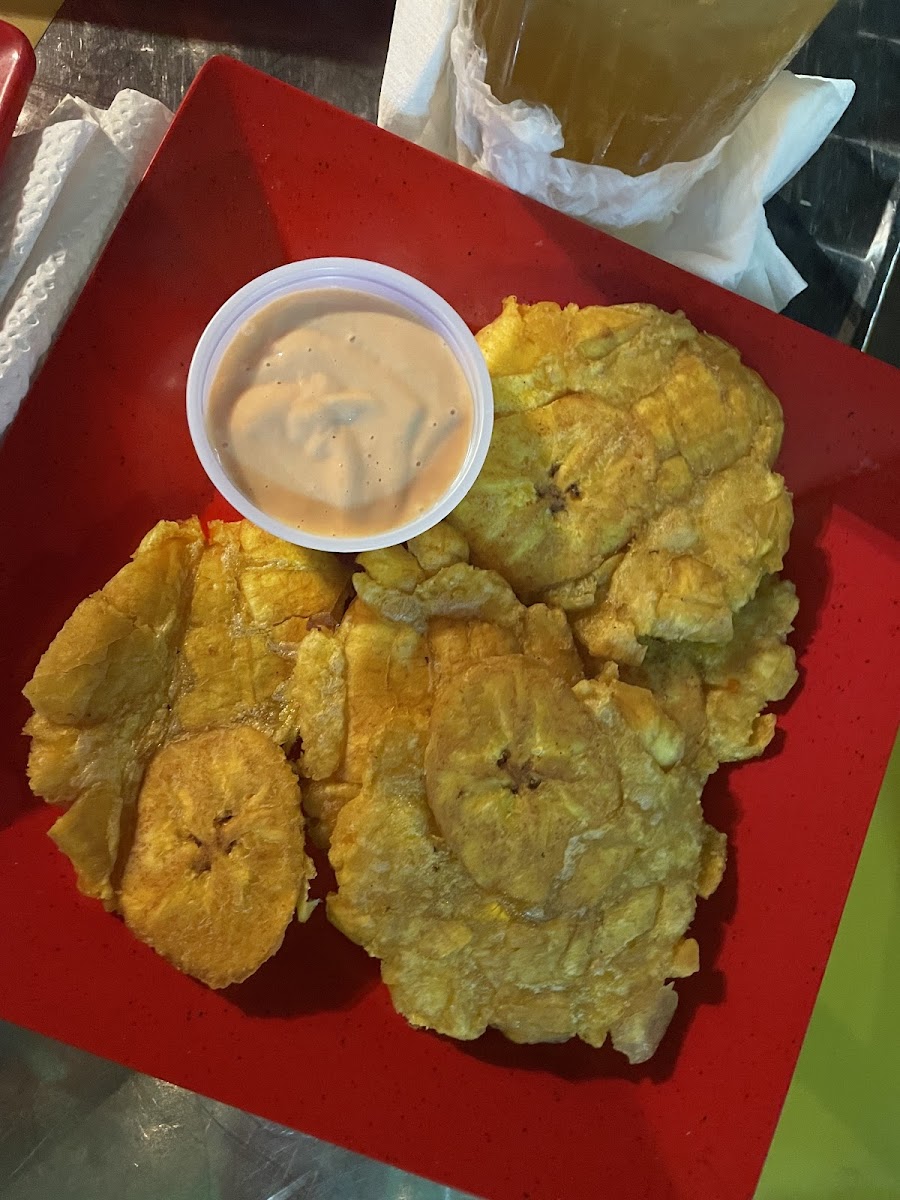 Tostones served with a mayo base dipping sauce