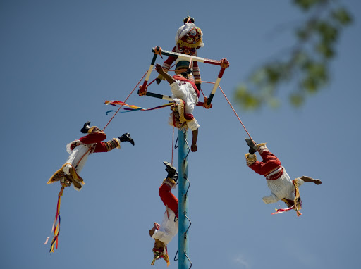 Cruise-Tulum13 - Voladores perform a traditional but dangerous flying pole dance at the retail complex outside the Tulum ruins.