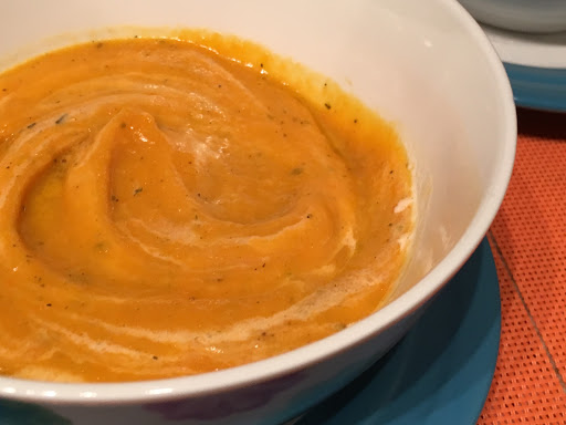 A bowl of carrot soup.