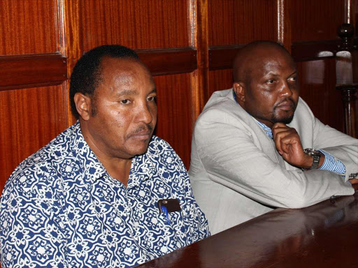 Kabete MP Ferdinand Waititu (left) and Gatundu South MP Moses Kuria at the Milimani law court on Wednesday,December 21 during the hearing of their hate speech case. /COLLINS KWEYU