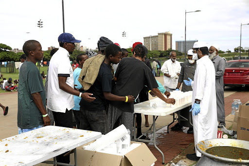 If it's lunchtime it must be food from the Muslim community as people from four faiths in Durban work to feed homeless people.