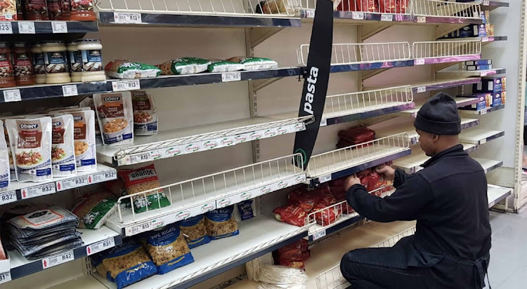 Vincent SupaSpar filling up the empty pasta shelves as shoppers flocked to shops to stock up.