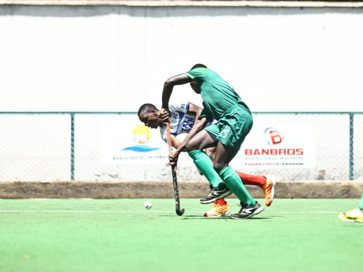 Butali's George Mutira is challenged by Western Jaguars' Awino Wiswa during their ACC match at the Dashmesh Hockey Stadium, Nairobi