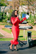 Host Nambitha Ben-Mazwi speaking to guests at the Bombay event in Hyde Park, Johannesburg. 